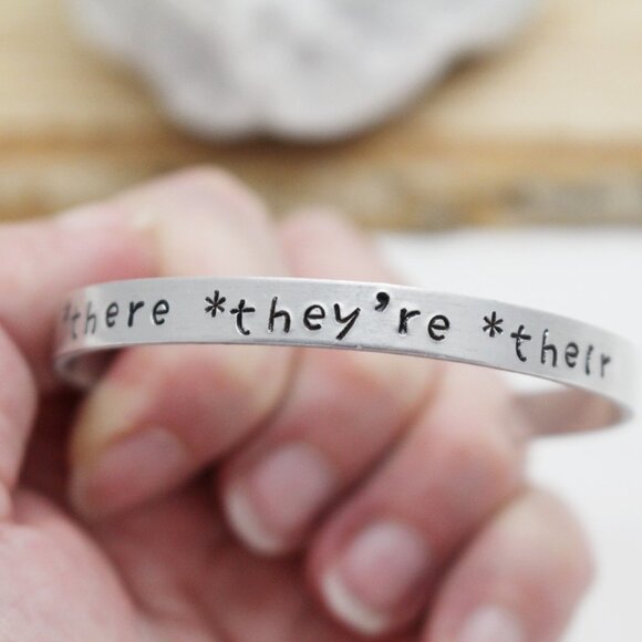 *There *They're *Their - Hand Stamped Anodized Aluminum Bangle - Adjustable - Picture 5 of 14